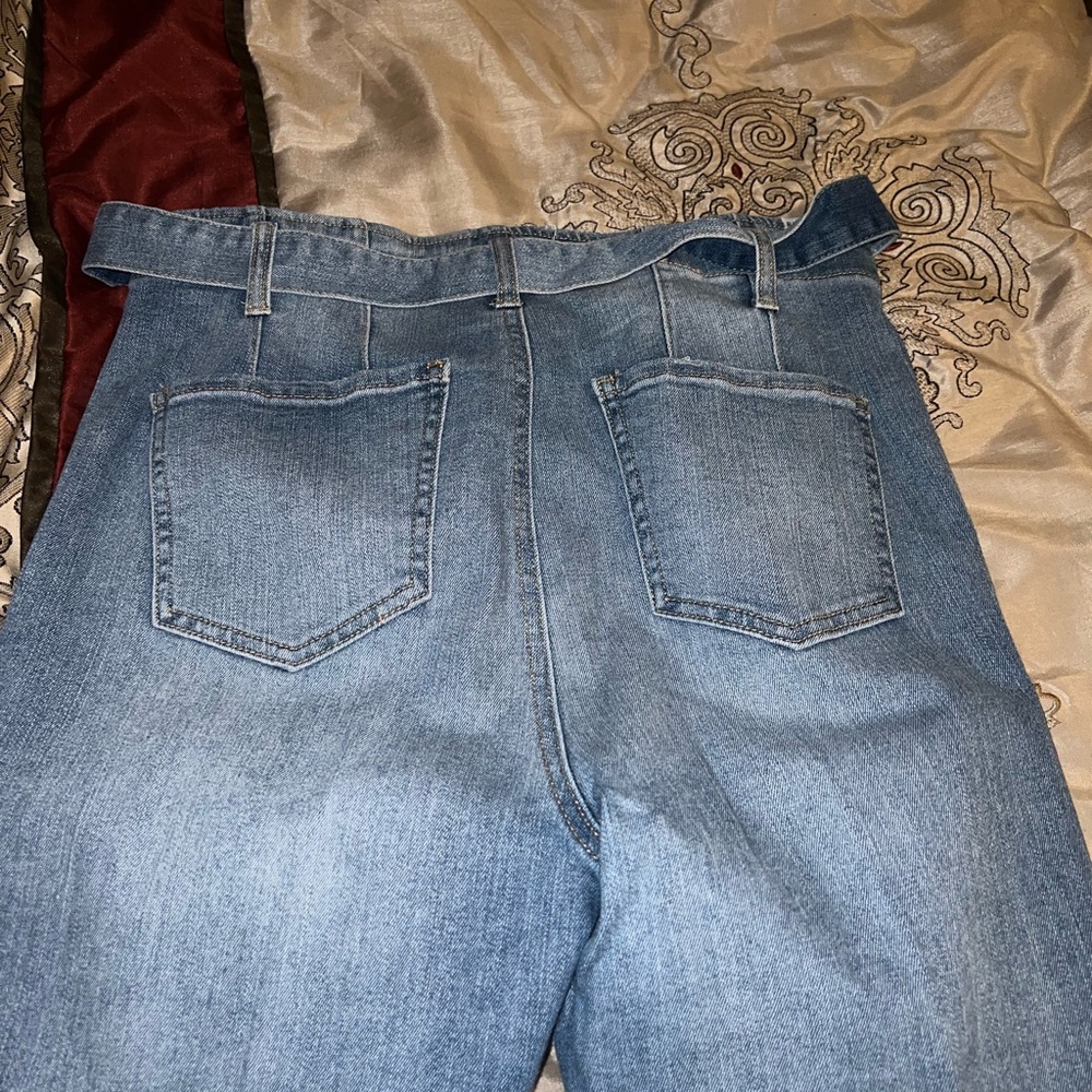 Light wash, ripped skinny jeans. Size 13, fits big. Has belt that comes off